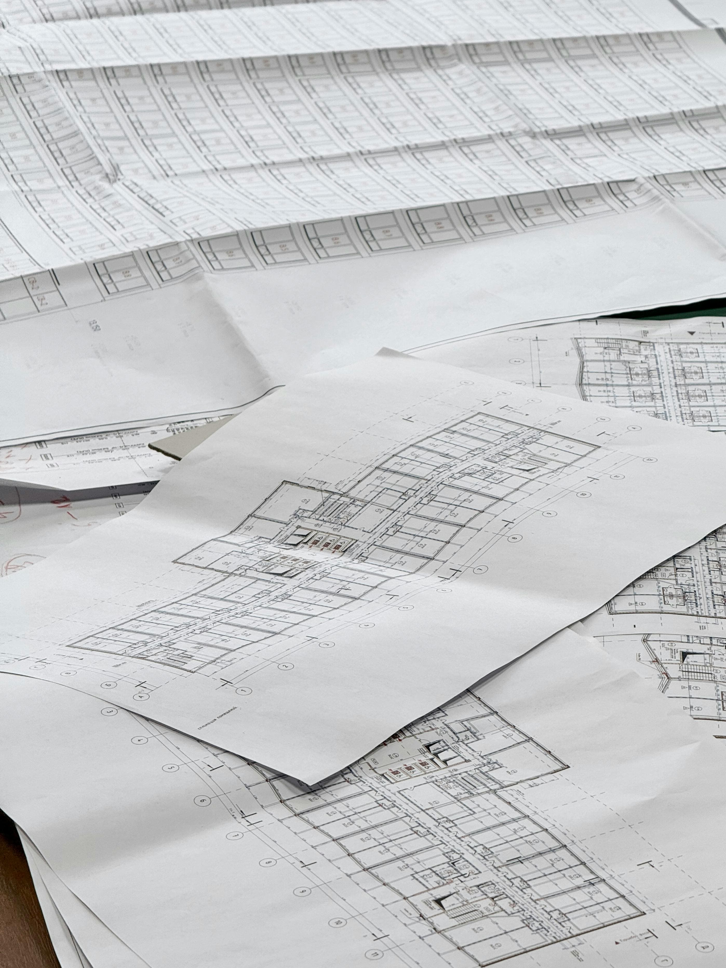 Detailed technical blueprints laid out on a desk
